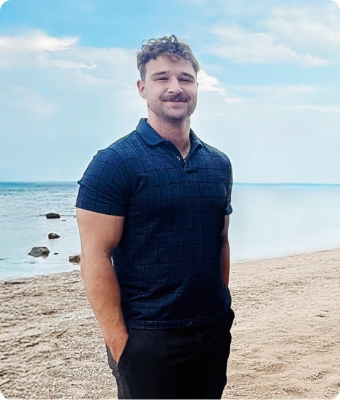 Ethan Lockwood standing on a beach